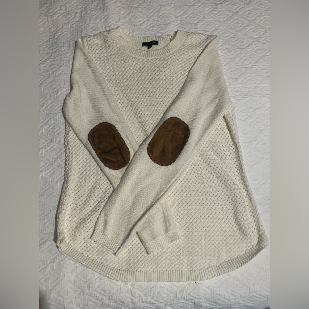 Cream colored sweater with faux suede elbow patches